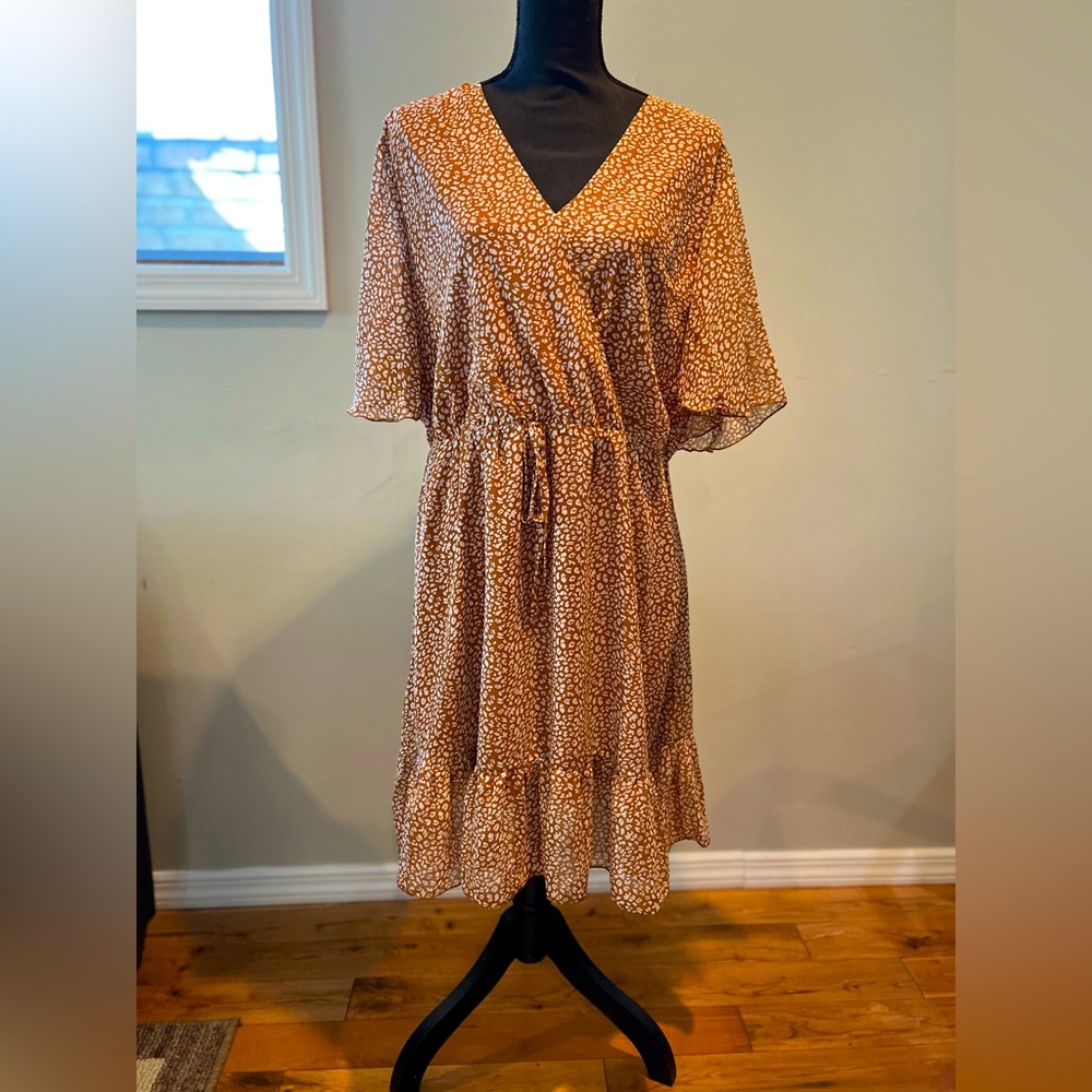 Tan and white print. Classic style
